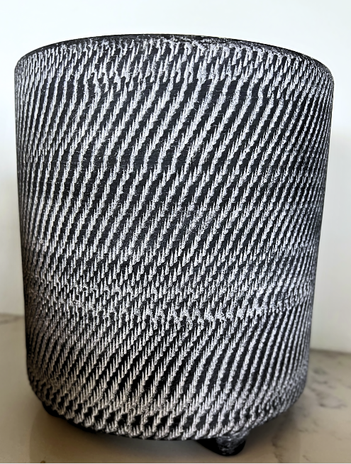 Black footed stoneware pot